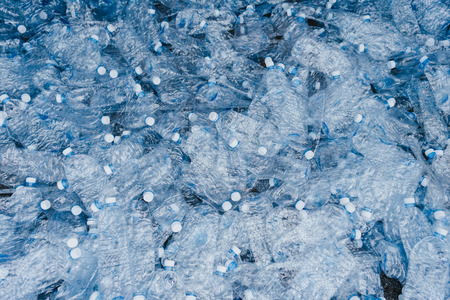 Plastic bottles background : The recycle process of PET plastic bottles.