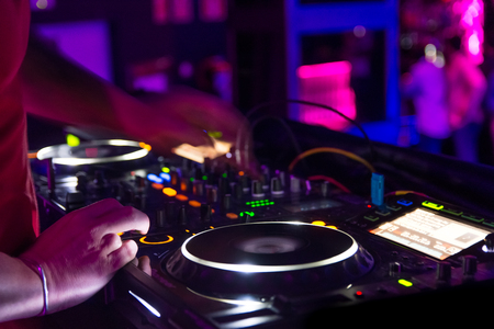 dj play with mixer in disco night clubの写真素材
