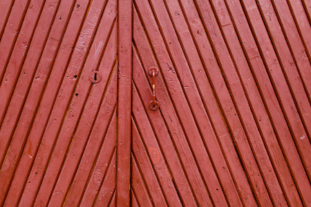 Old red vintage wooden painted doorの写真素材