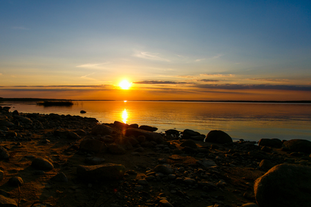 Colorful sunset over rippling lake surface, Belarusの写真素材