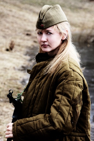 The girl the guerrilla of the period of the Second World War in the military form with the German...