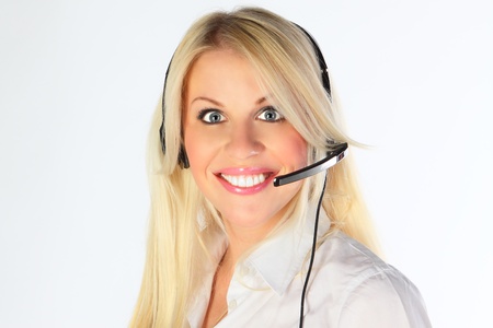 Support phone operator in headset at workplaceの写真素材