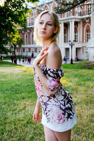 The beautiful and young girl walks in parkの写真素材