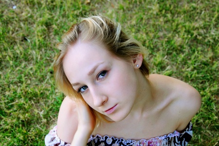 The beautiful and young girl walks in parkの写真素材