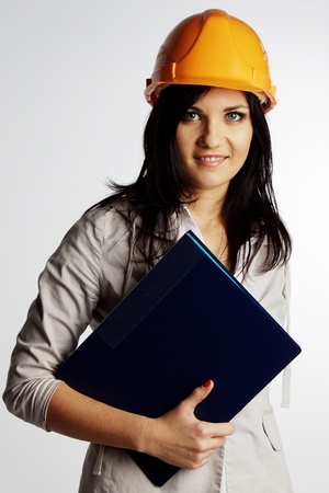 Beautiful young girl in the construction helmetの写真素材