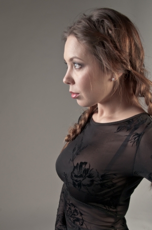Portrait of a young and beautiful girl in a dark-colored clothingの写真素材