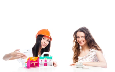 two young and beautiful girls with the layout of a country houseの写真素材