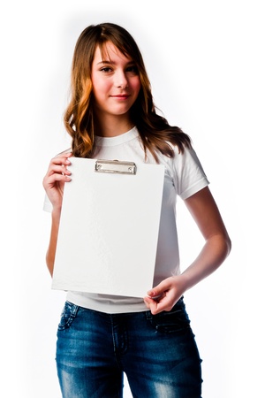 young and beautiful girl with a blank sheet of whiteの写真素材