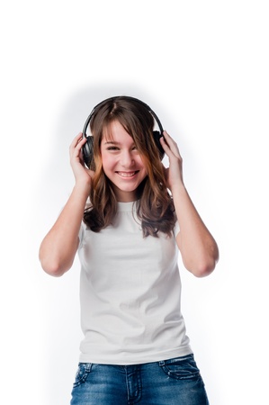 Beautiful girl listening to music on headphonesの写真素材