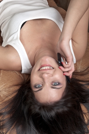 beautiful and young woman listening to music on headphonesの写真素材
