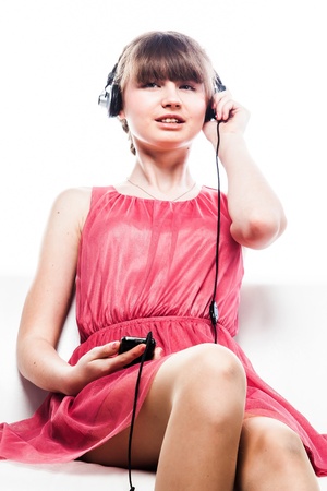 beautiful and young woman listening to music on headphonesの写真素材