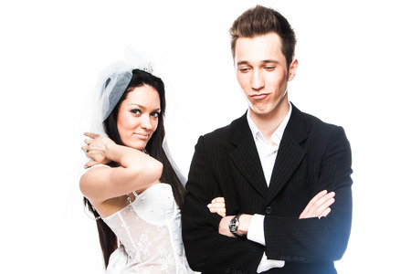 Beautiful and young married couple isolated on a white backgroundの写真素材