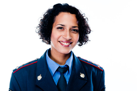 young and beautiful woman in police uniformの写真素材