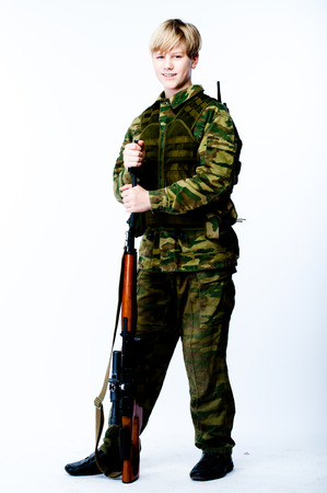 young man in camouflage with a sniper rifleの写真素材
