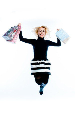 young attractive woman with shopping bagsの写真素材