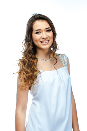 Young and beautiful woman in white dressの写真素材