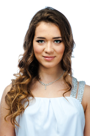 Young and beautiful woman in white dressの写真素材