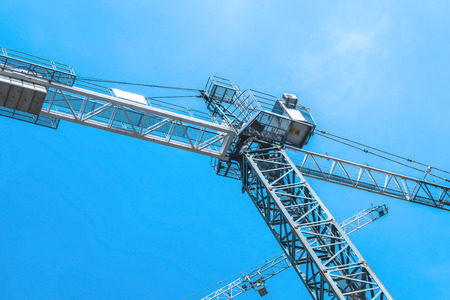 Construction crane against the skyの写真素材