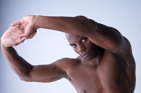 A young african american stretching before an exercise routine.の写真素材