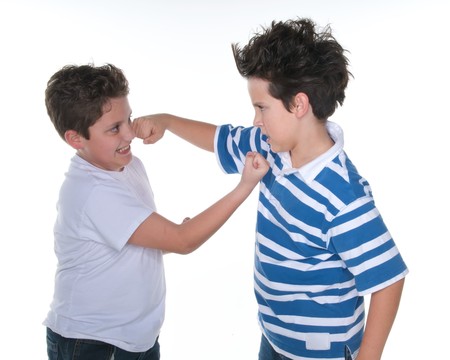 Boys fighting over white backgroundの写真素材