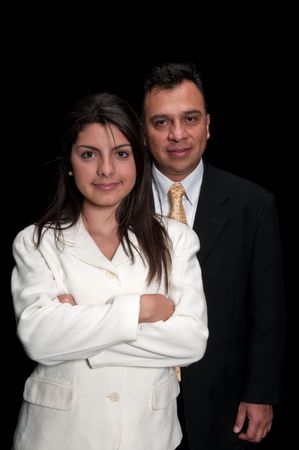 Hispanic team of boss and secretary standing on black background.の写真素材