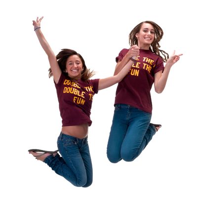 Young friends jumping together very happy and high.の写真素材
