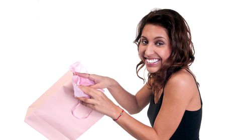 Young hispanic woman very happy receiving a present.の写真素材