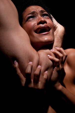 Young hispanic woman being choked and abused.の写真素材