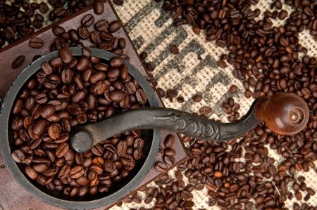 Detail of Old Coffee Grinder and beans with Burlap.の写真素材