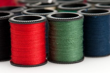 Close up of thread bobbins. Macro shot with use of selective focus.の写真素材