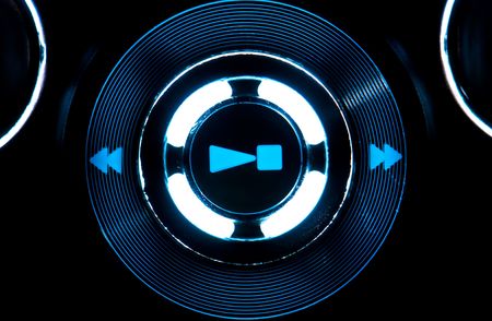 View of play, stop, symbol control of mpe player with blue light.