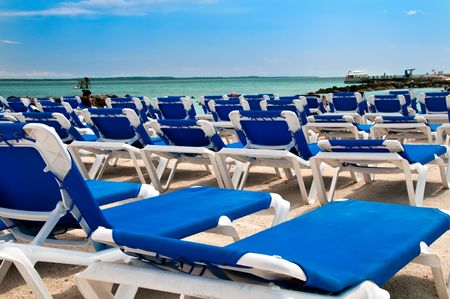 View of Chairs at beach in the Bahamas in the Caribbean.