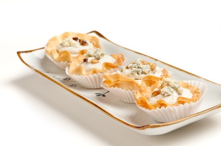 Group of Blue Cheese and walnut Volauvent. Volauvent is a tiny round canapé made of puff pastry. The term ' vol au vent ' means ' blown by the wind ' in French.の写真素材