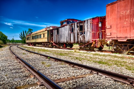 Old and rusted wagon trains over a railway.の写真素材