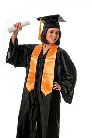 Portrait of young girl with graduation gown and diploma.の写真素材