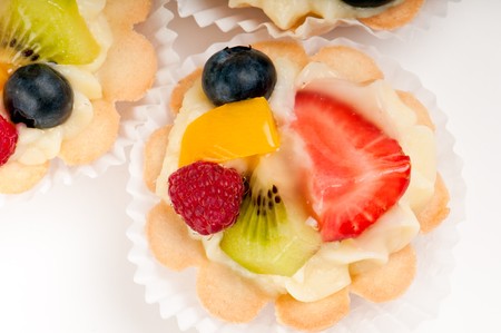 Dessert made of fruit salad over a voulavent pastry. Volauvent is a tiny round canape made of puff pastry. The term ' vol au vent ' means ' blown by the wind ' in French.の写真素材