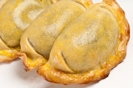 Group of Latin american empanadas. The Empanada is a pastry turnover filled with a variety of savory ingredients and baked or fried.の写真素材