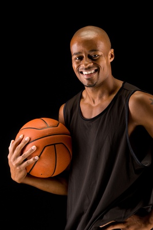 Young african american basketball player smiling.の写真素材