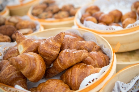 Basket with croissants  served in a buffet with space for copy on top の写真素材