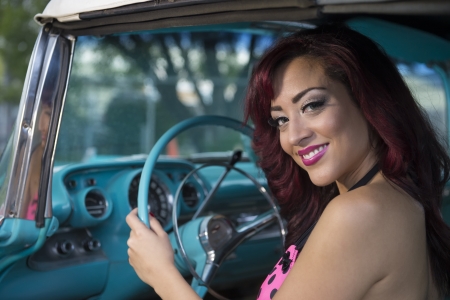 Young woman smiling in a carの写真素材