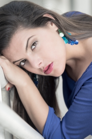 Portrait of young hispanic woman looking at camera very seriousの写真素材