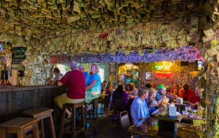 BIG PINE KEY, FL - CIRCA 2012: Patrons on famous No Name Pub circa 2012. The pub is a landmark in the Florida Keys, a popular tourist destination with over 2 million yearly visitors.の写真素材