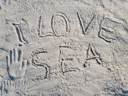 The inscription on the sand "I love the sea"の写真素材
