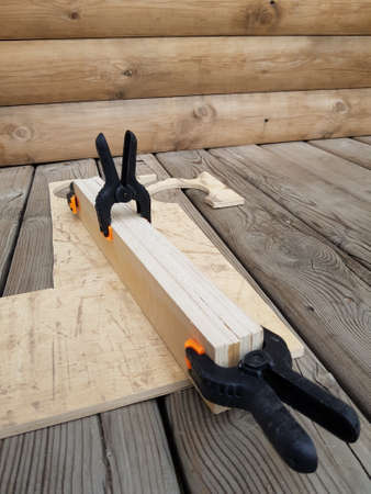 The joiner glues wooden planks togetherの写真素材