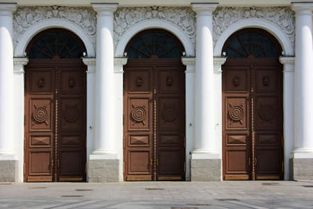 Antique wooden doors in a stone building