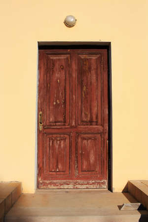 Antique wooden door in a stone wall