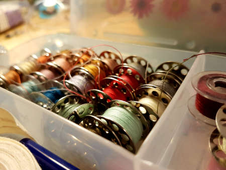 Spools of thread are in a box