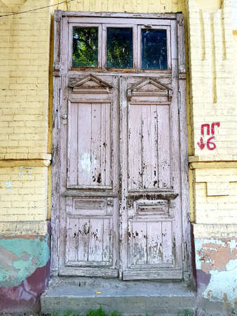 Wooden door in an old stone buildingの写真素材