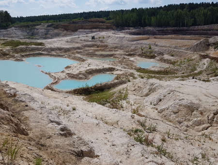 Turquoise water in pits in a quarry