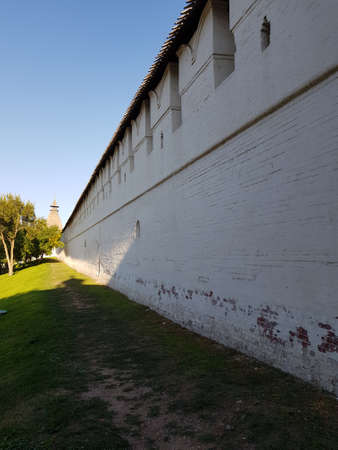 White walls and towers of a medieval fortressの写真素材